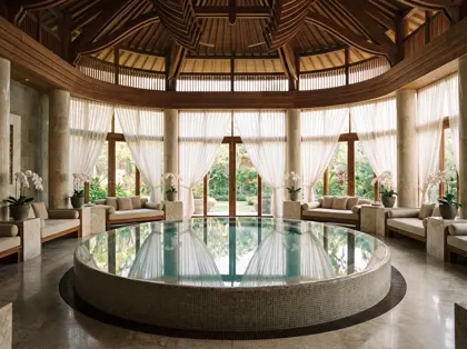 Grand spa hall with central hydrotherapy pool in a longevity resort